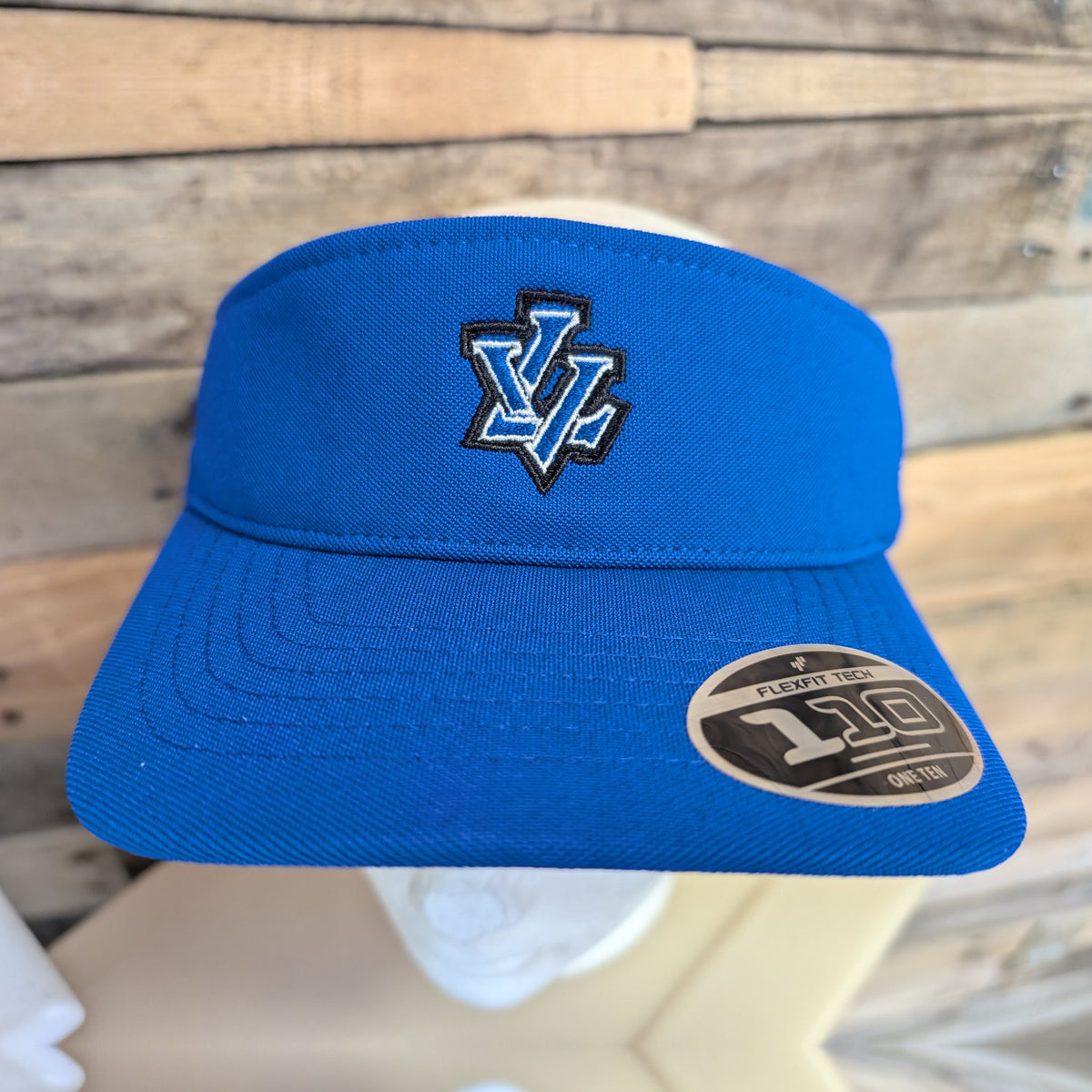 Leavenworth Pioneers royal blue Flexfit 110 visor with embroidered LV logo - front view