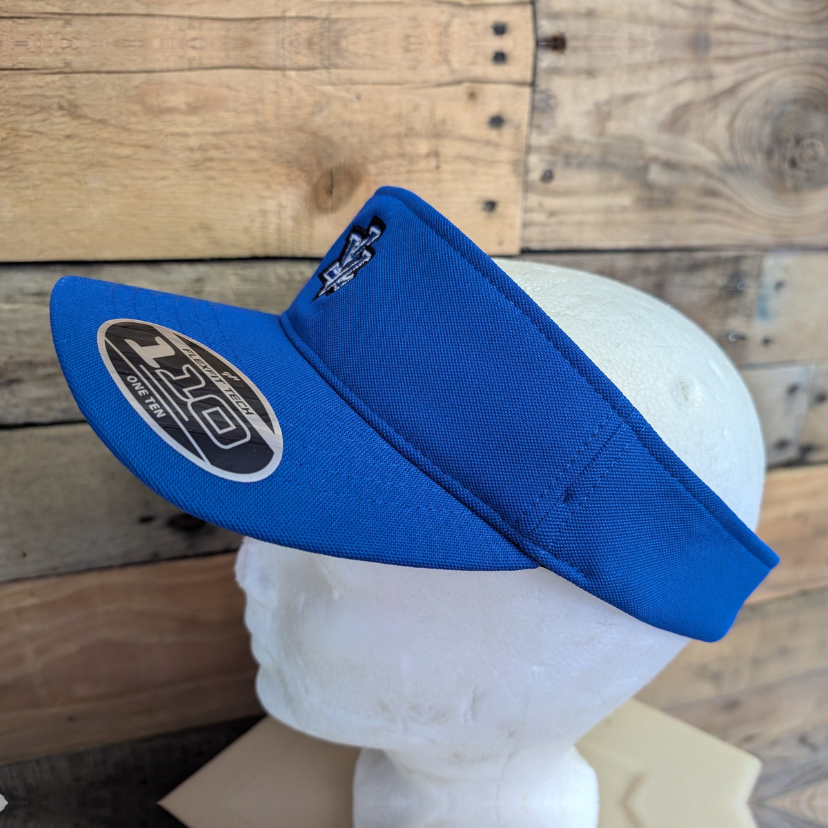 Leavenworth Pioneers royal blue Flexfit 110 visor with embroidered LV logo - side view