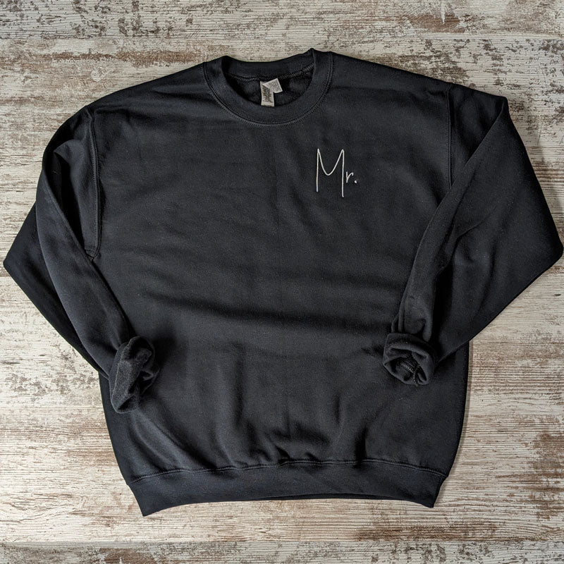 Black crewneck sweatshirt with white script Mr. embroidered on the chest